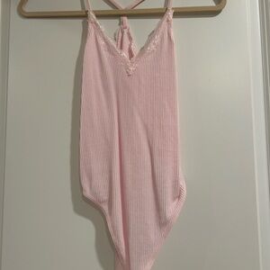 Pink body suit